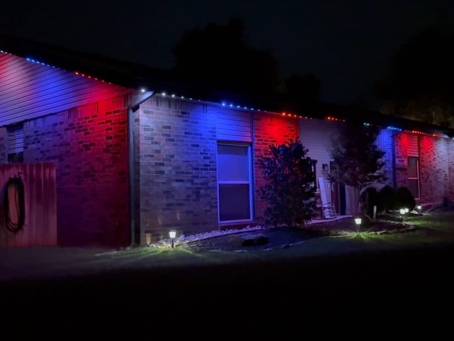 Video of a brick ranch home in Joliet, IL with red and blue color-changing permanent lighting