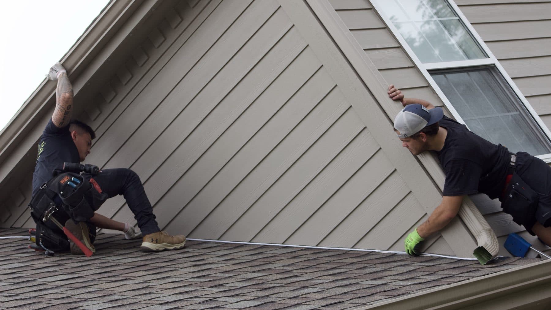 TruLight Chicago crew installing permanent roofline lighting