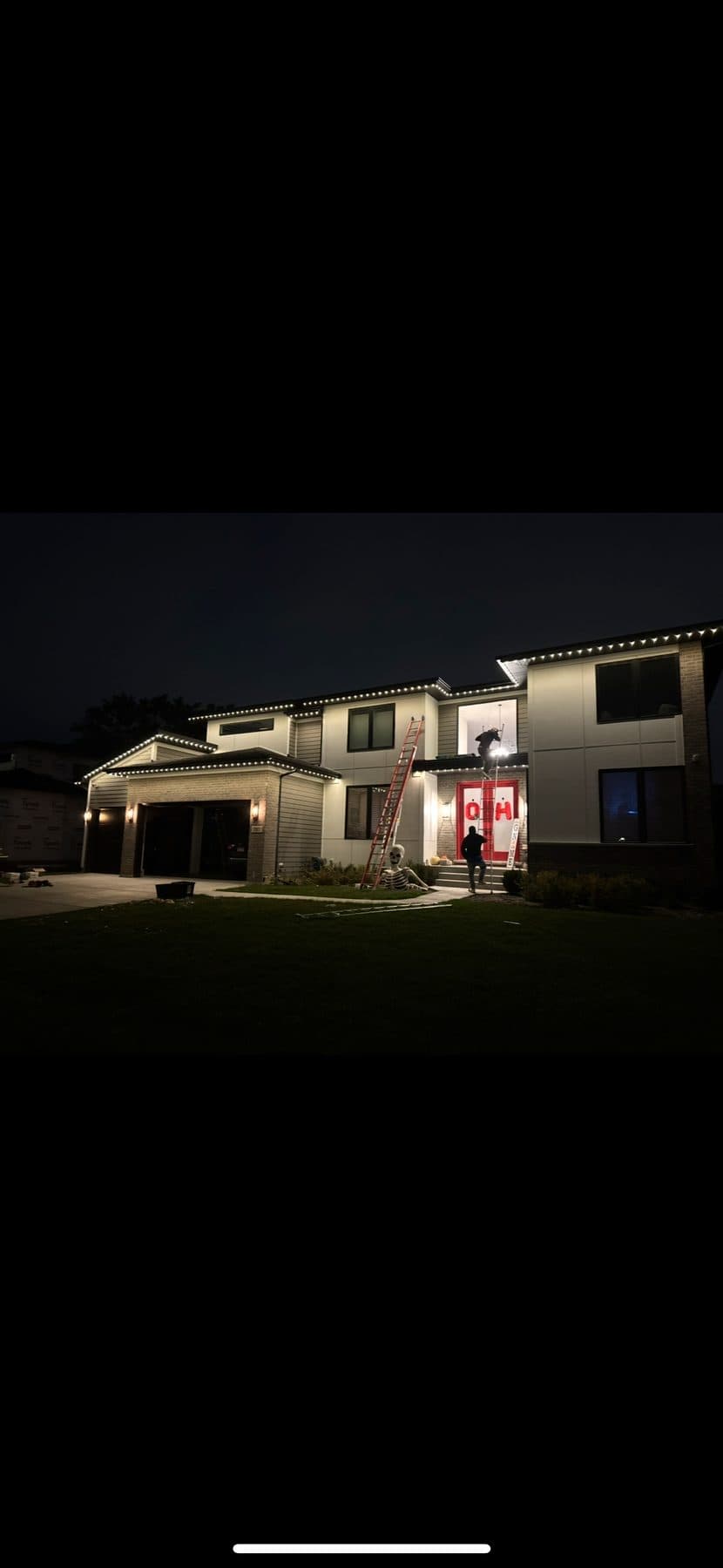 TruLight Chicago technician installing permanent roofline lighting